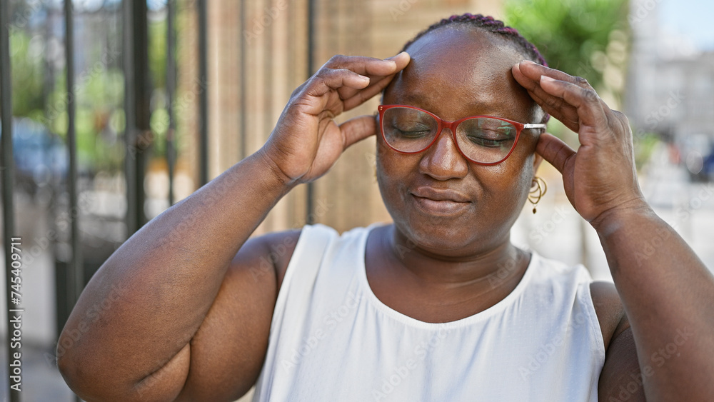 Stressed african american woman with braids, feeling headache ache on urban street, showcasing despair expression Stressed african american woman with braids, feeling headache ache on urban street, showcasing despair expression