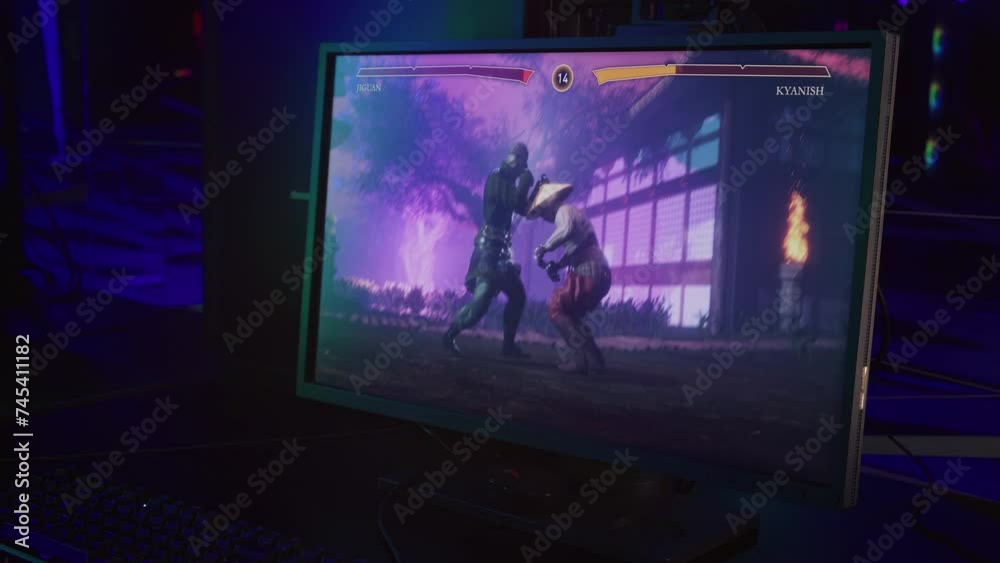 Wide computer screen displaying the ongoing fight in the melee combat game. Gaming screen showing the fight between digital characters. Playing the versus fighting game on the gaming screen. Wide computer screen displaying the ongoing fight in the melee combat game. Gaming screen showing the fight between digital characters. Playing the versus fighting game on the gaming screen.