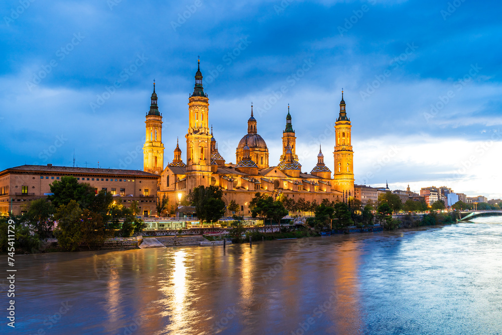 Evening landscape of the Cathedral Basilica of Our Lady of the Pillar on the banks of river Ebro in Zaragoza, Aragon, Spain