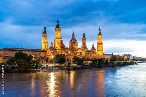 Evening landscape of the Cathedral Basilica of Our Lady of the Pillar on the banks of river Ebro in Zaragoza, Aragon, Spain