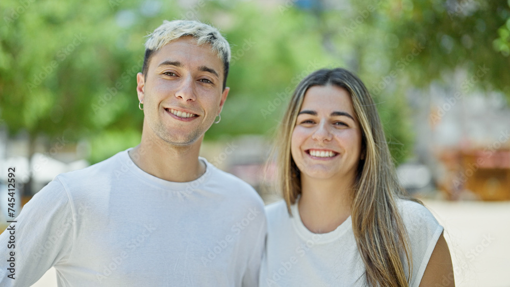 Beautiful couple smiling confident standing together at park Beautiful couple smiling confident standing together at park