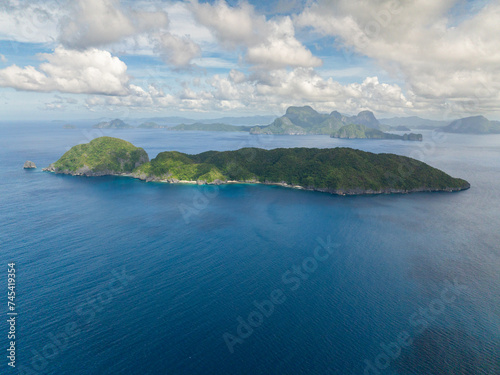 Inambuyod Island surrounded by blue sea. Blue sky and clouds. El Nido, Philippines. © MARYGRACE