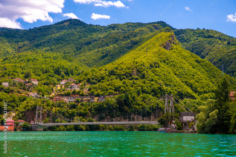 Suspension Bridge Over Lake Jablanica Against Verdant Hills, Bosnia and Herzegovina