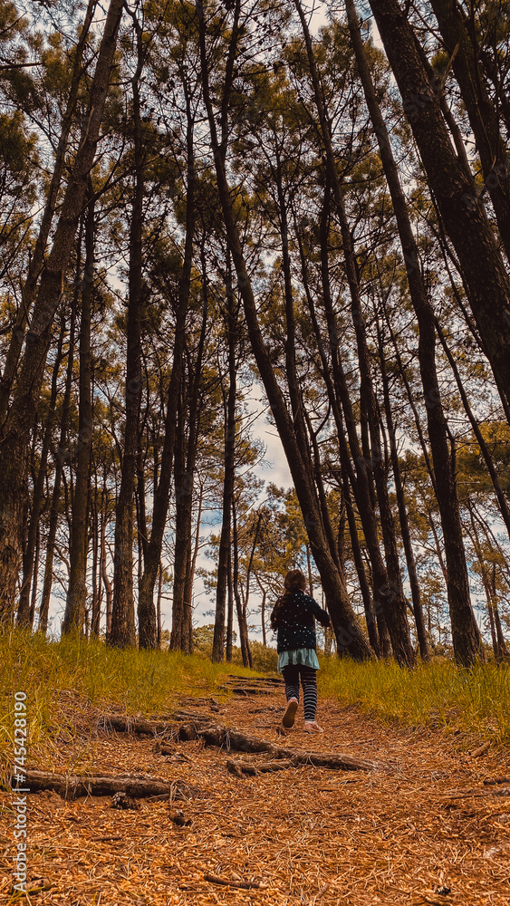 Girl wandering in the forest