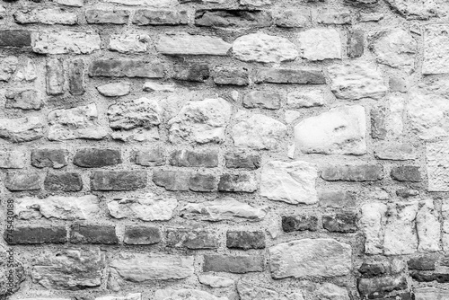 Toned art texture of old stonewall, close-up. Stone brick wall for publication, poster, calendar, post, screensaver, wallpaper, postcard, banner, cover, website. High quality photo