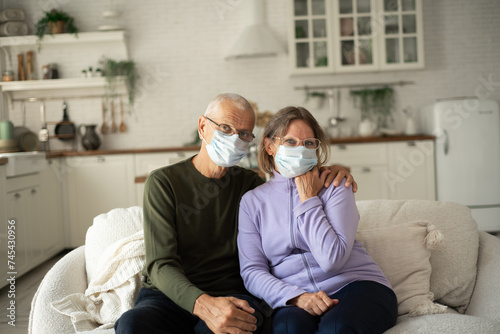 Elderly couple in medical masks during the pandemic Covid-19