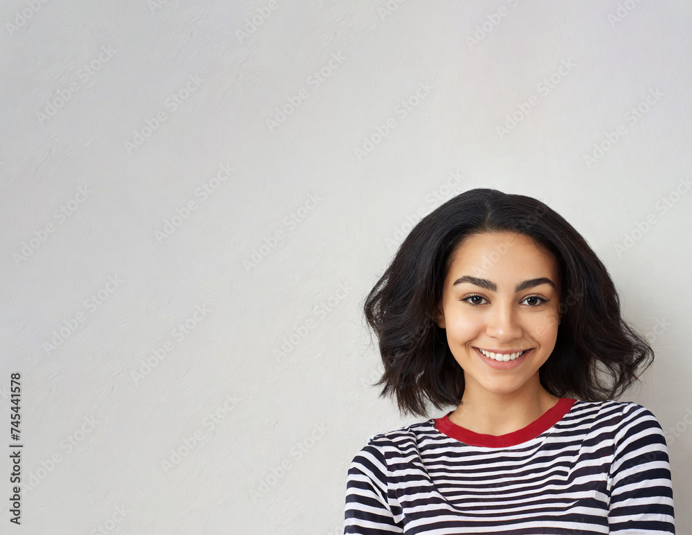 mage of happy woman standing, posing over white wall background mage of happy woman standing, posing over white wall background