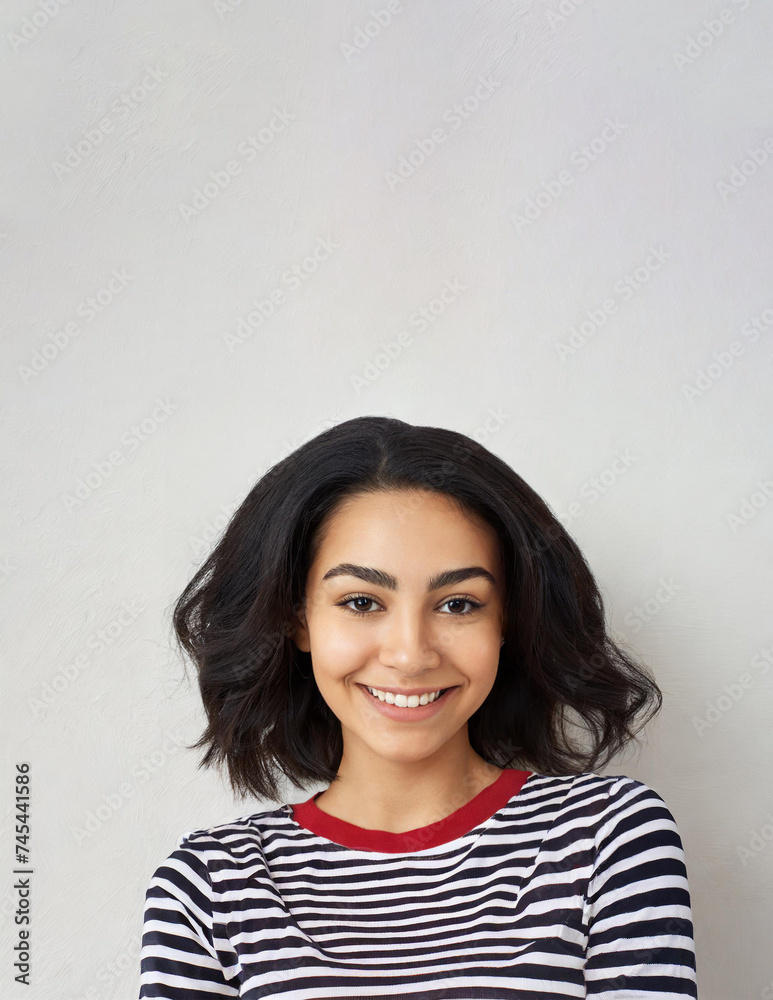 mage of happy woman standing, posing over white wall background mage of happy woman standing, posing over white wall background