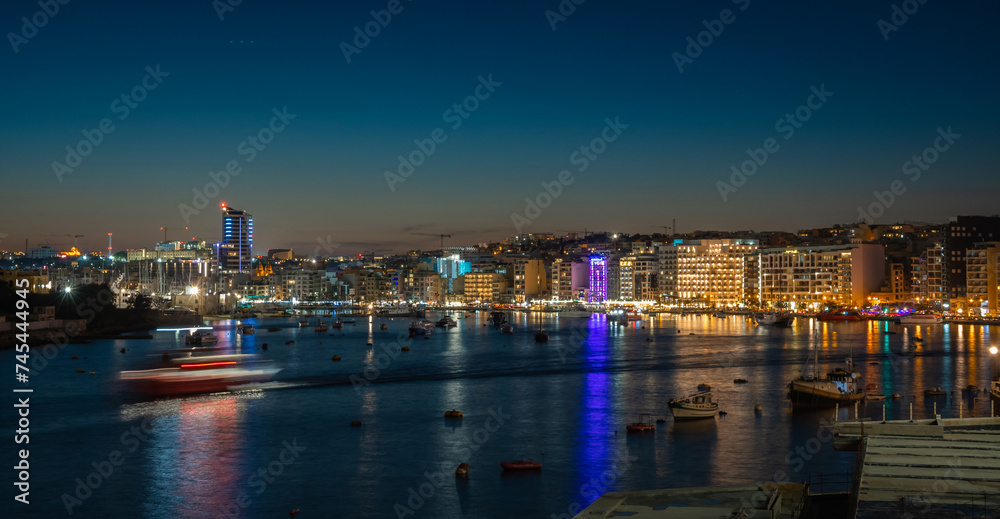 Beautiful night cityscape and coast in Sliema, Malta
