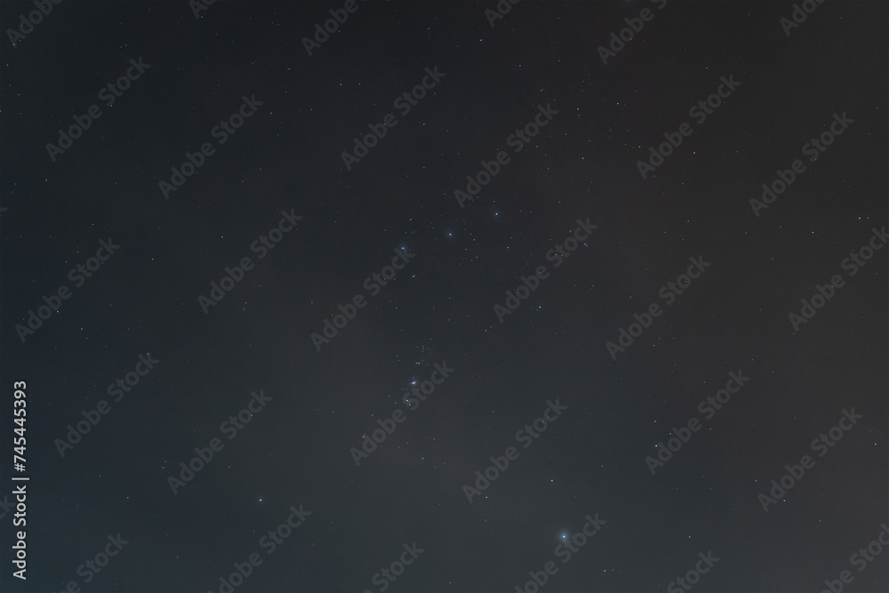 Fototapeta premium Starry sky over Estonia, the Orion nebula and stars. Photo background texture.