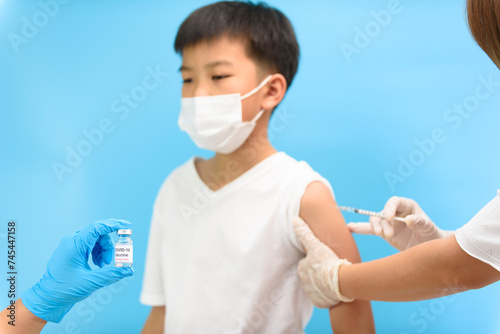 Vaccination in young Asian boy