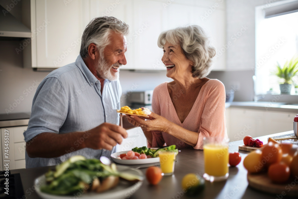 Caucasian married senior mature couple cooking in the kitchen Caucasian married senior mature couple cooking in the kitchen
