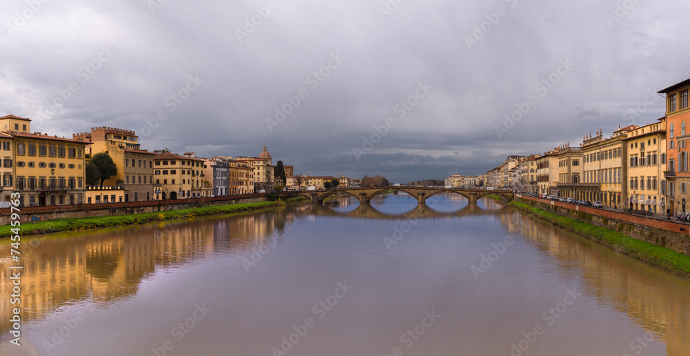 Arno River with Ponte alla Carraia bridge in Florence city