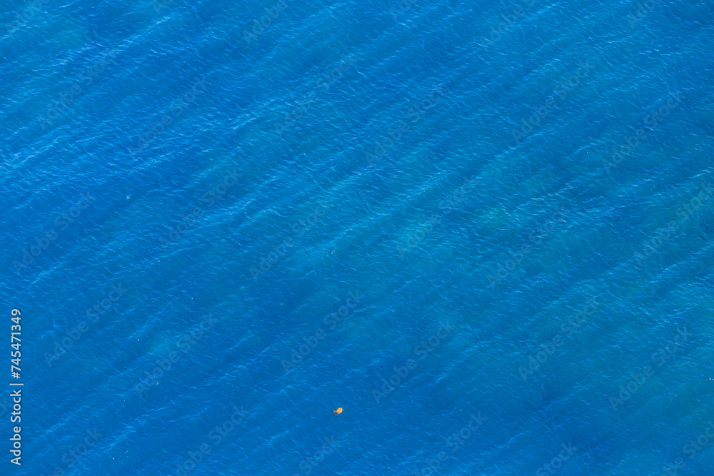 Aerial view blue sea background. Marine natural background texture with copy space. Drone view.