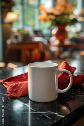 A white coffee mug mock up, on a black marble countertop with a red napkin behind it. 
