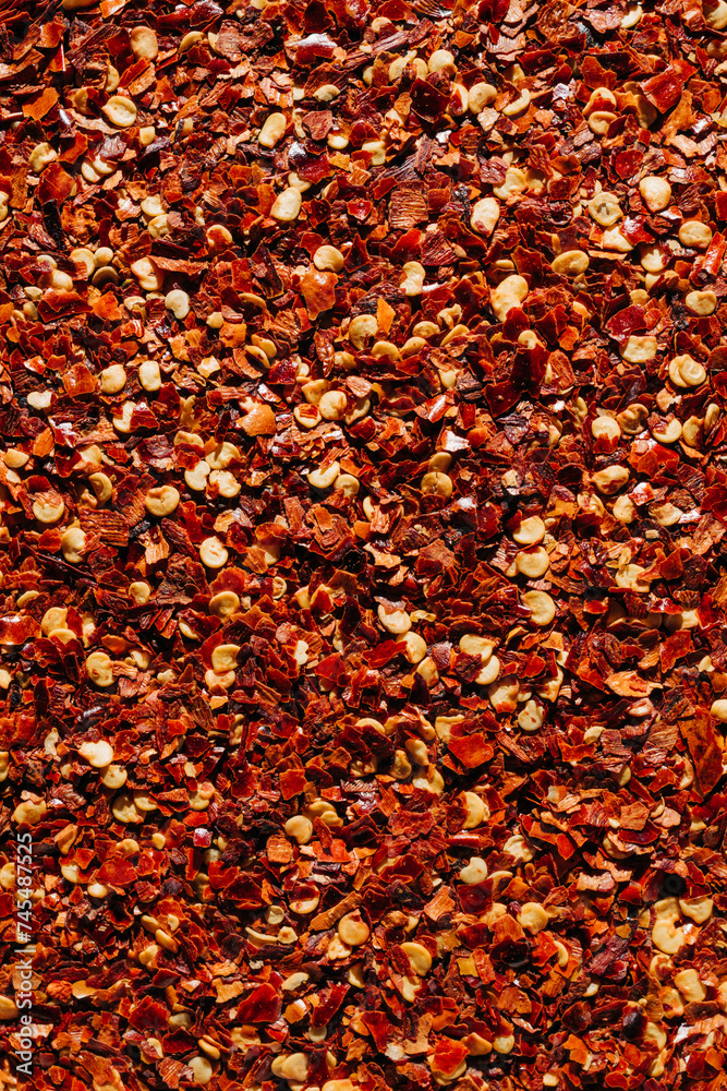 Fiery Red Bliss: Close-Up of Saturated Chili Flakes Texture