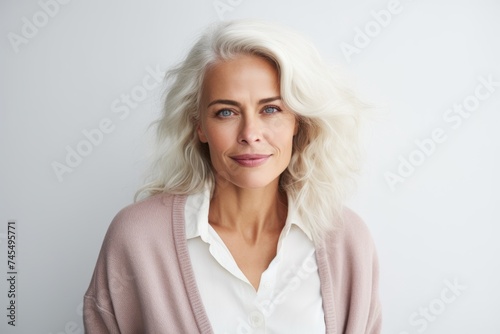 Portrait of a beautiful mature woman with blond hair looking at camera