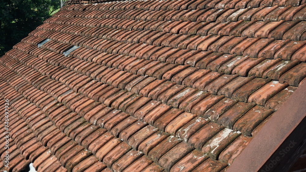 The neatly arranged tile roofs form a texture The neatly arranged tile roofs form a texture