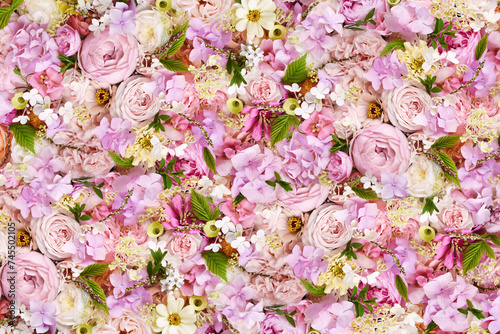 Delicate blooming roses and pink summer flowers, blossoming rose flower soft pastel background, bouquet floral card, festive flowerwall