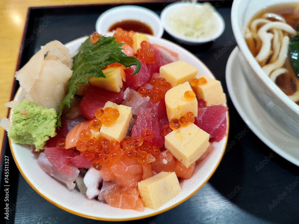 The bowl of rice with sashimi and sweet egg, Japanese food The bowl of rice with sashimi and sweet egg, Japanese food