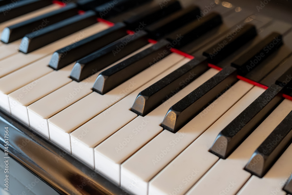 Old grand piano with ivory keys close up Old grand piano with ivory keys close up