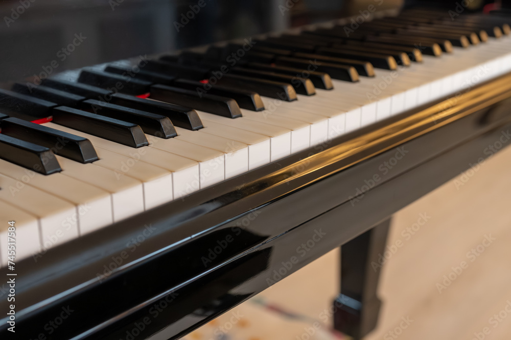 Old grand piano with ivory keys close up Old grand piano with ivory keys close up