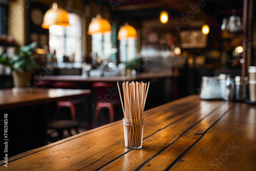 A commonplace disposable coffee stirrer on a cafe counter