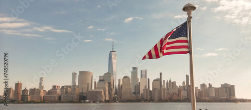 Manhattan, NYC aerial view. American flag in NYC. Memorial Day, Veteran's Day, 4th of July in NYC. American Flag Waving near New York City, Manhattan view. NYC, Manhattan skyline.