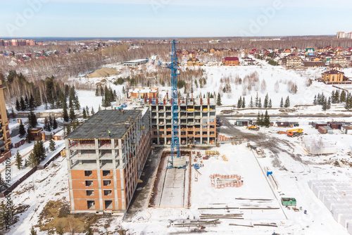Photography the construction site of an apartment building in the winter from a height