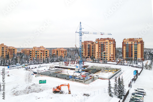 Photography the construction site of an apartment building in the winter from a height
