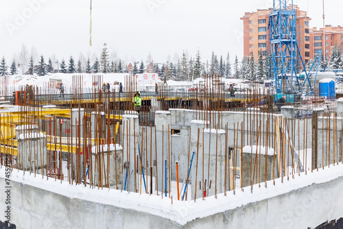 Photography the construction site of an apartment building in the winter from a height