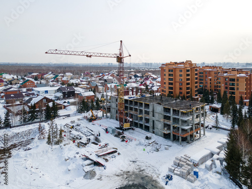 Photography the construction site of an apartment building in the winter from a height