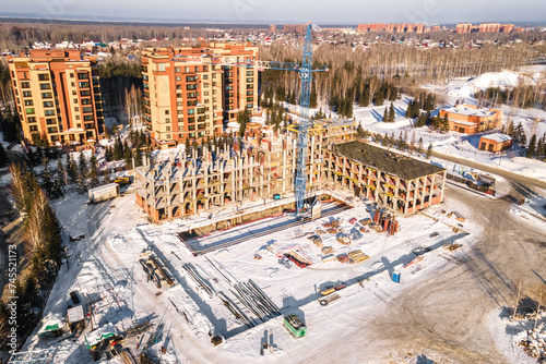 Photography the construction site of an apartment building in the winter from a height