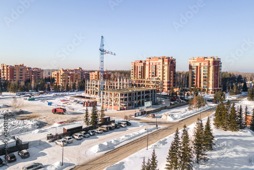 Photography the construction site of an apartment building in the winter from a height