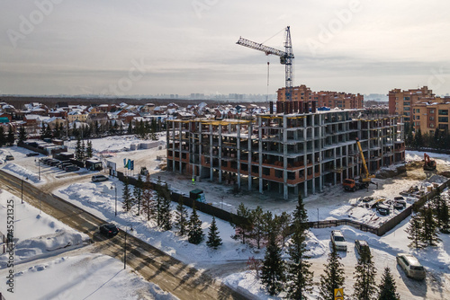 Photography the construction site of an apartment building in the winter from a height