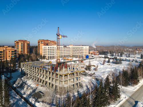 the construction site of an apartment building in the winter from a height © gluschenkoart