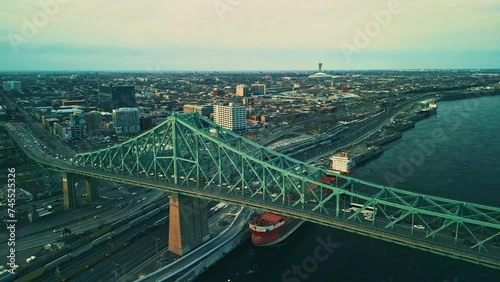 Montreal, Canada - Feburary 25 2024: Drone aerial view of Jaque Cartier Bridge over the Saint Laurant River in Montreal photo