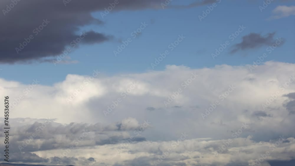 White clouds cover the blue sky, then get darker and dissipate. Time-lapse. White clouds cover the blue sky, then get darker and dissipate. Time-lapse.