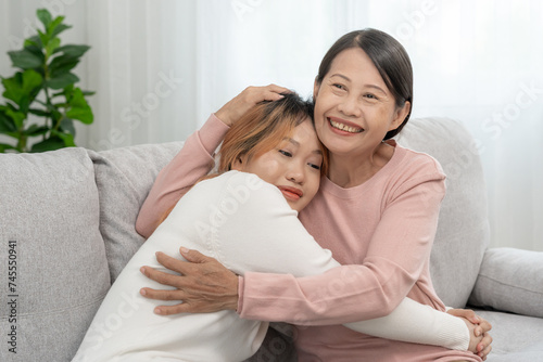 Mother day, cute asian teen girl hugging mature middle age mum. Love, kiss, care, happy smile enjoy family time. celebrate special occasion, happy birthday, merry Christmas. special day