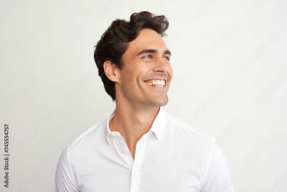 Portrait of happy smiling young handsome man, over grey background. Portrait of happy smiling young handsome man, over grey background.