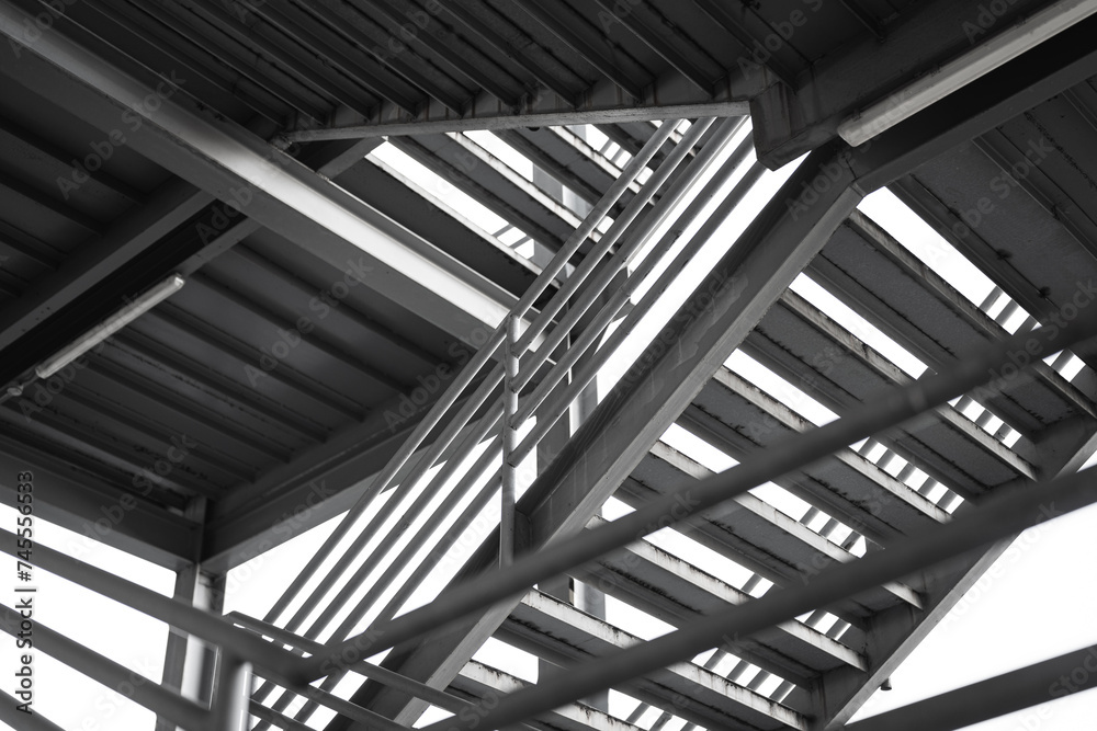 Metal overpass platform with banister structure of the factory place. Industrial building part. Close-up and selective focus. Metal overpass platform with banister structure of the factory place. Industrial building part. Close-up and selective focus.