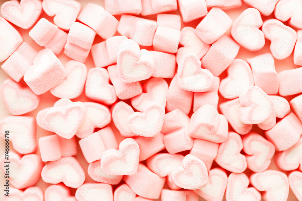 Colorful candies in heart shape. Valentines day background.