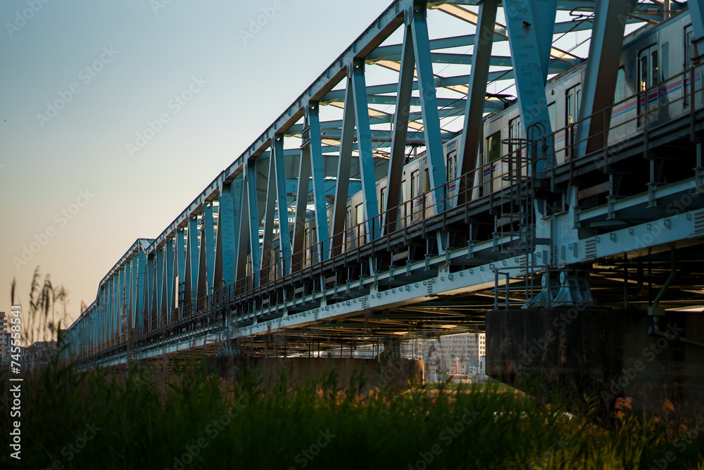 Train running on the railway bridge in the evening | 夕方の電車 Train running on the railway bridge in the evening | 夕方の電車