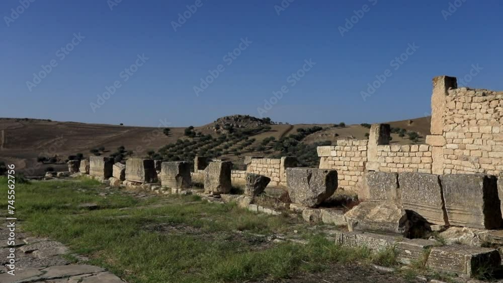Ancient Roman ruins in Dougga against a clear blue sky, sunny day Ancient Roman ruins in Dougga against a clear blue sky, sunny day