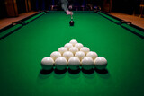 Billiard man player arm breaking the pyramid by striking the ball with cue stick