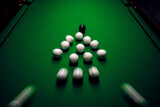 Strong hit by a player with a billiard cue on the ball