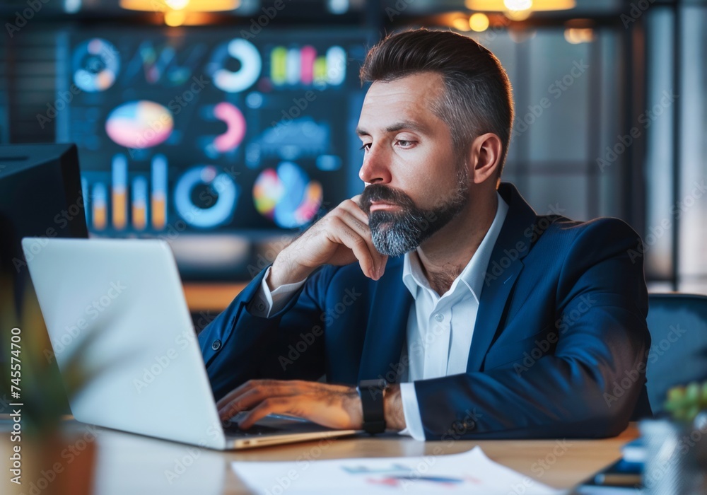 Professional Man Concentrating on His Work at a Late Evening Office Setting Professional Man Concentrating on His Work at a Late Evening Office Setting