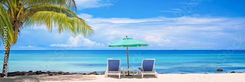 Panorama tranquil beach scene, with azure waters, under bright blue umbrella. Concept banner tourism, lux travel place for relax on tropical. photo
