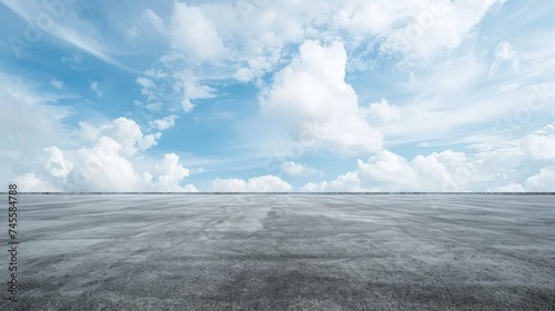 Vast outdoor concrete canvas under the open sky a minimalist dream with endless asphalt pure copyspace