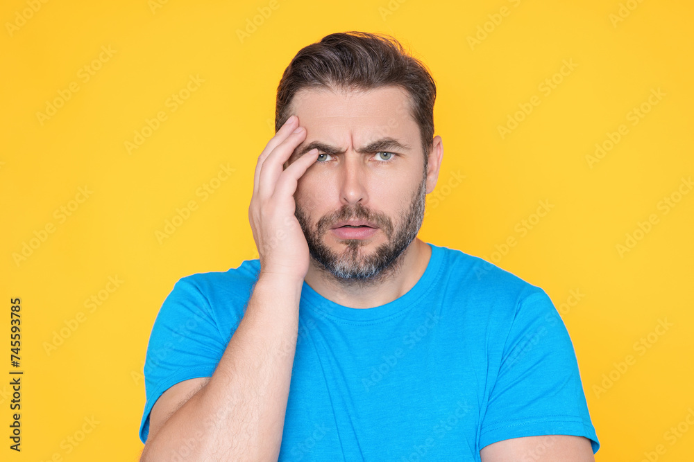 Portrait of thinking man with confused puzzled face on studio isolated background. Man thinking, pensive expression, thoughtful face. Doubt concept. Serious expression, doubting and choice. Portrait of thinking man with confused puzzled face on studio isolated background. Man thinking, pensive expression, thoughtful face. Doubt concept. Serious expression, doubting and choice.